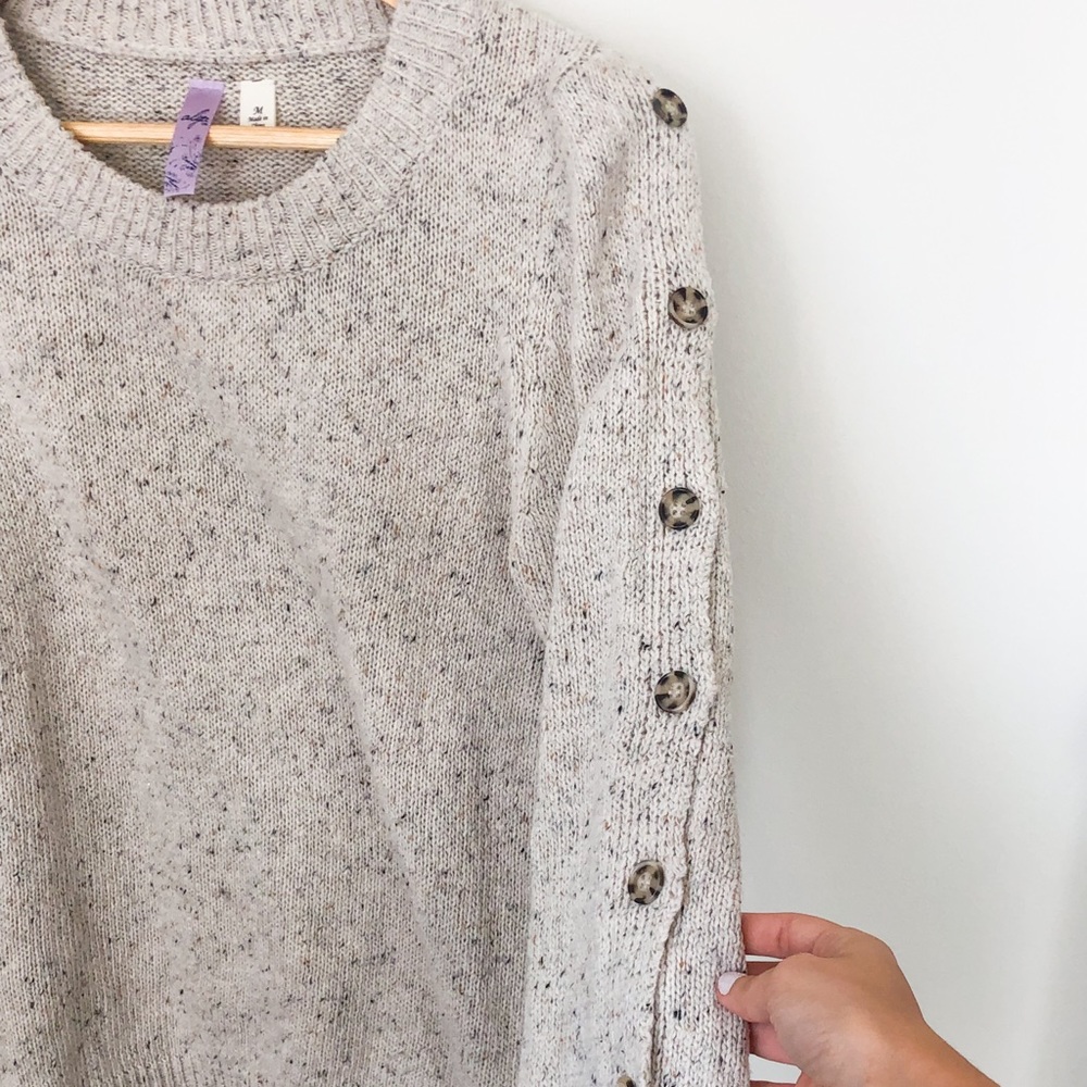 Speckled cream sweater + buttons on sleeves